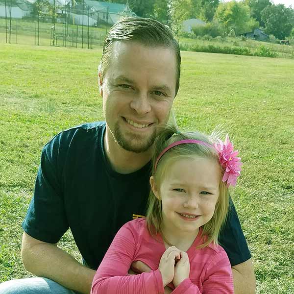 Image of Jeremy Bumpus with daughter